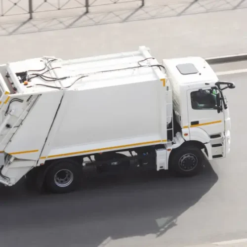 Truck collecting waste